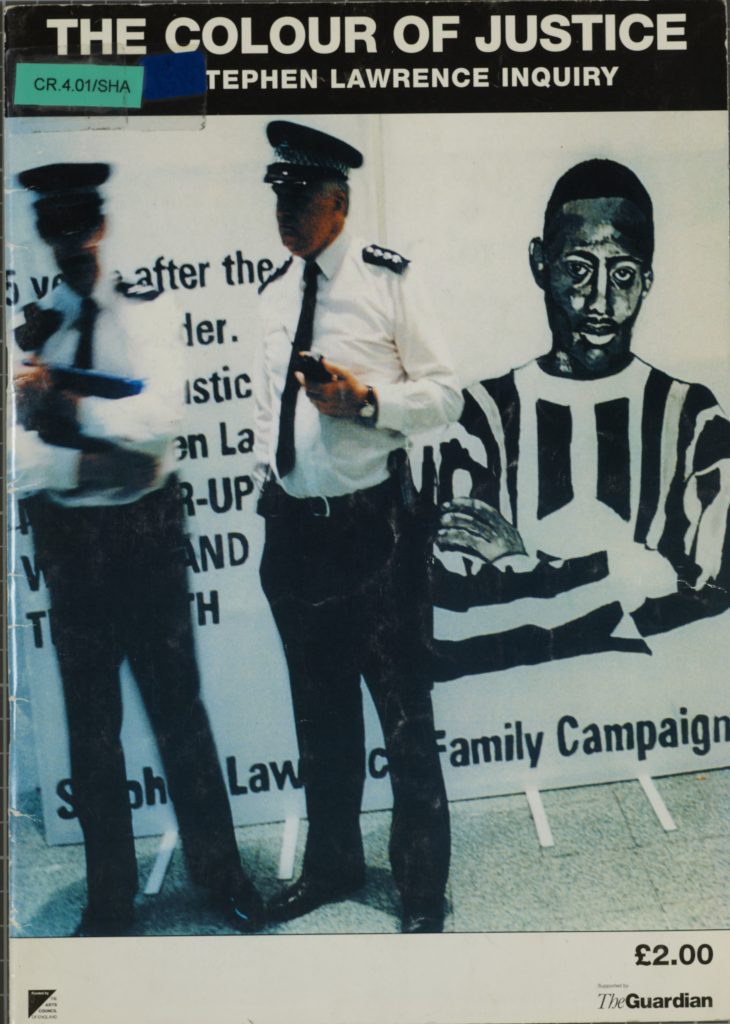 Book cover with title 'The colour of Justice' with image of 2 police officers in front of Stephen Lawrence Family Campaign poster. 