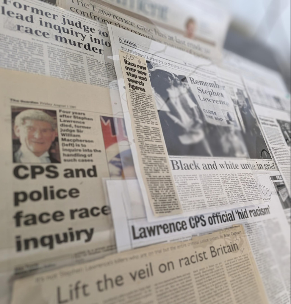 Collage of newspaper cuttings overlapped on top of each other and blurred. 