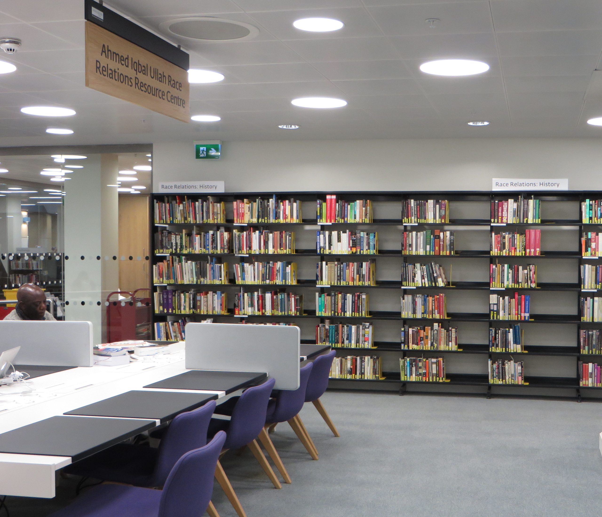 A photograph of the Ahmed Iqbal Ullah RACE Centre at the Central Library. Workspace with bookshelves in the background.