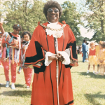 Mambu wearing Lord Mayor's robes in the park